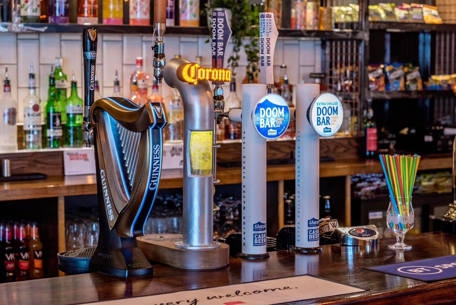 Beer taps and bar at The Falstaff Inn